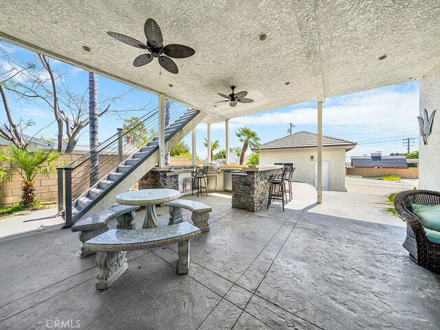 8309 Hillside Rd, Alta Loma, CA 91701 - view of patio featuring stairway, fence, and a ceiling fan