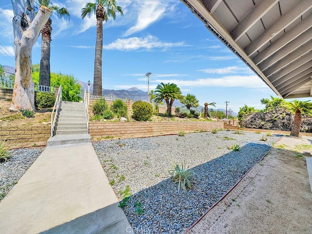 8309 Hillside Rd, Alta Loma, CA 91701 - view of yard featuring stairs, a mountain view, and fence
