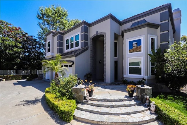 26962 Willow Tree Ln, Laguna Hills, CA 92653 - view of front of property with an attached garage, fence, stucco siding, and driveway