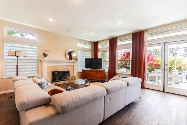 26962 Willow Tree Ln, Laguna Hills, CA 92653 - living room featuring recessed lighting, a premium fireplace, wood finished floors, and a healthy amount of sunlight