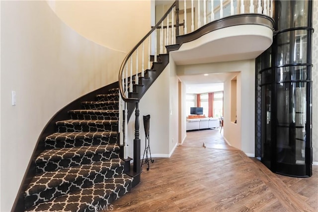 26962 Willow Tree Ln, Laguna Hills, CA 92653 - foyer entrance with baseboards, wood finished floors, and stairs