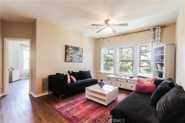 26962 Willow Tree Ln, Laguna Hills, CA 92653 - living room with ceiling fan, a wealth of natural light, dark wood-style flooring, and visible vents