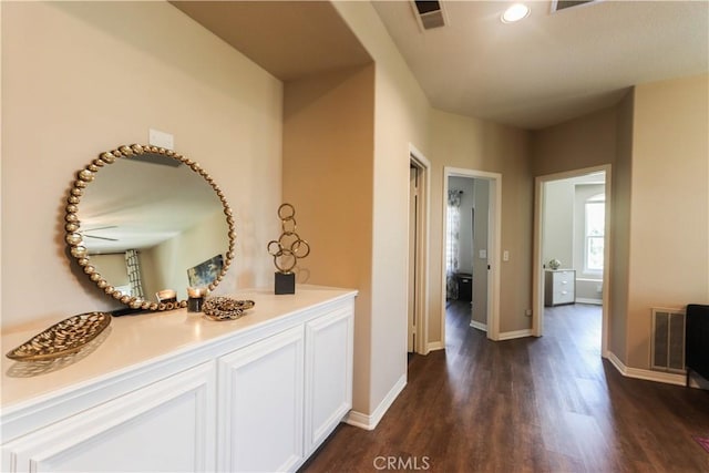 26962 Willow Tree Ln, Laguna Hills, CA 92653 - hall featuring baseboards, dark wood-type flooring, visible vents, and recessed lighting