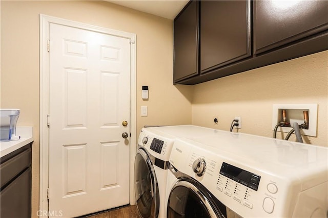 26962 Willow Tree Ln, Laguna Hills, CA 92653 - clothes washing area with cabinet space, dark wood-style flooring, and separate washer and dryer