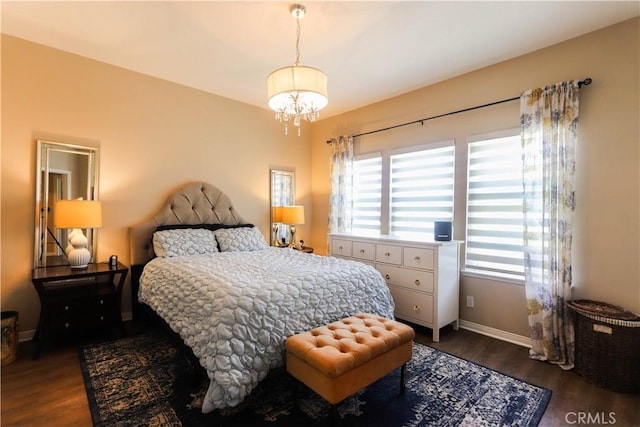 26962 Willow Tree Ln, Laguna Hills, CA 92653 - bedroom with baseboards, an inviting chandelier, and dark wood-style flooring