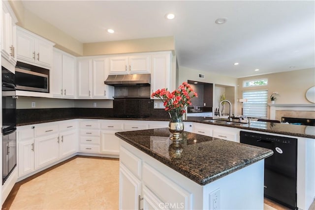 26962 Willow Tree Ln, Laguna Hills, CA 92653 - kitchen with a sink, black appliances, white cabinetry, a peninsula, and under cabinet range hood
