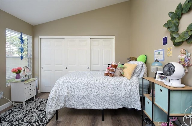 23898 Via Pamilla, Murrieta, CA 92562 - bedroom featuring lofted ceiling, dark wood-type flooring, and a closet
