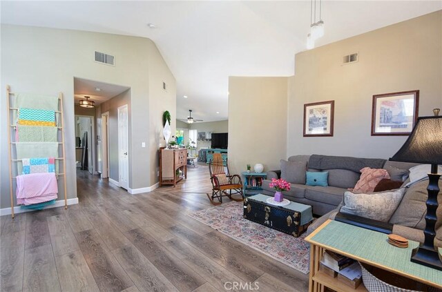 23898 Via Pamilla, Murrieta, CA 92562 - living room with a ceiling fan, wood finished floors, high vaulted ceiling, and baseboards