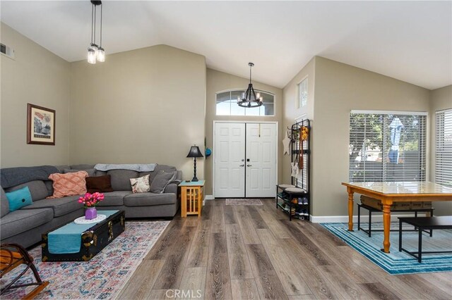 23898 Via Pamilla, Murrieta, CA 92562 - foyer entrance featuring a chandelier, wood finished floors, plenty of natural light, and high vaulted ceiling