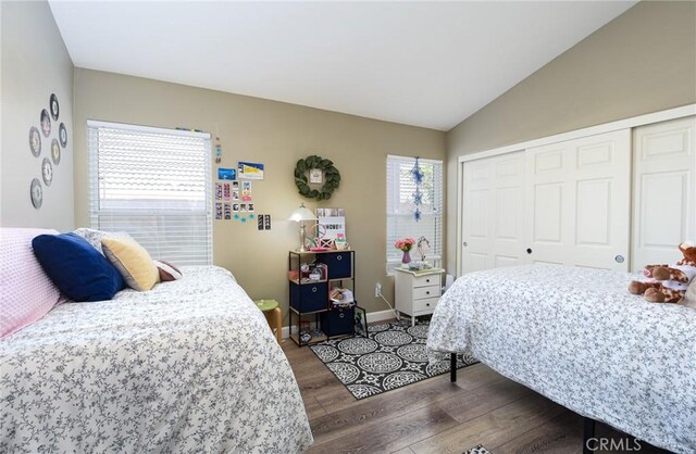 23898 Via Pamilla, Murrieta, CA 92562 - bedroom featuring wood finished floors, a closet, lofted ceiling, and baseboards