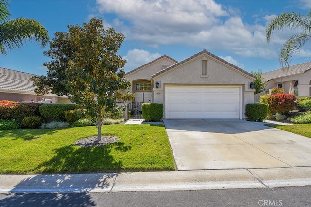 23898 Via Pamilla, Murrieta, CA 92562 - view of front of property featuring a front yard, concrete driveway, an attached garage, and stucco siding