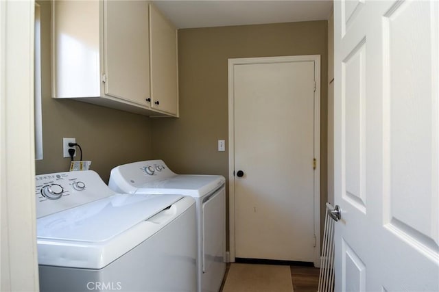 23898 Via Pamilla, Murrieta, CA 92562 - laundry area with washer and clothes dryer, cabinet space, and wood finished floors