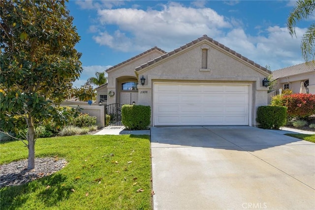 23898 Via Pamilla, Murrieta, CA 92562 - view of front of property featuring driveway, a garage, stucco siding, and a gate