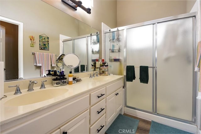23898 Via Pamilla, Murrieta, CA 92562 - full bathroom with a shower stall, double vanity, and wood finished floors