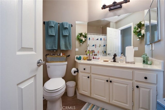 23898 Via Pamilla, Murrieta, CA 92562 - bathroom with toilet, vanity, a shower with shower curtain, and wood finished floors