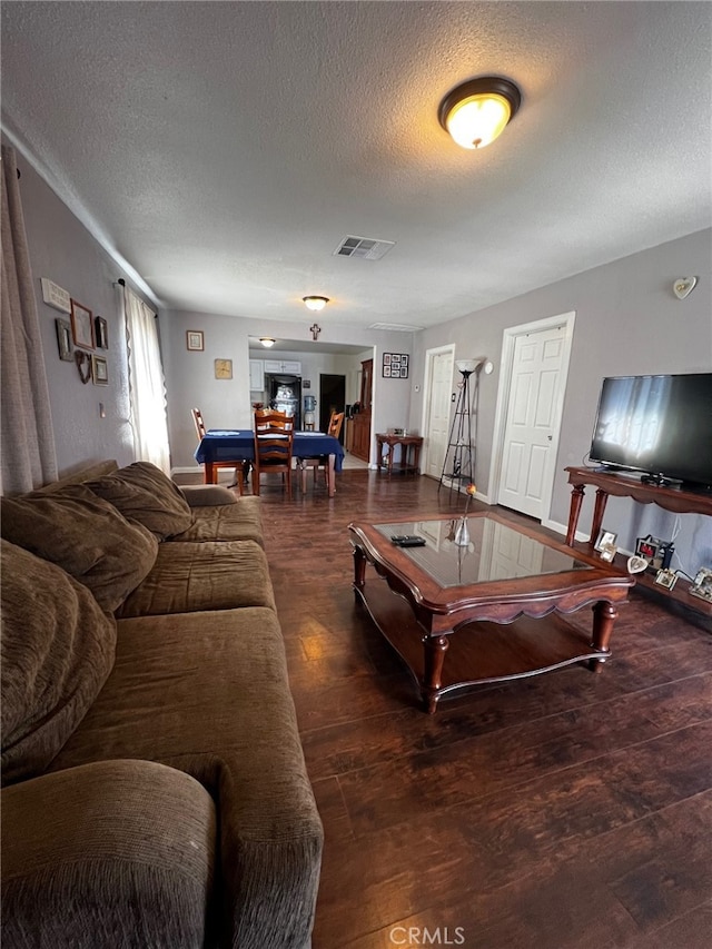living area featuring visible vents, a textured ceiling, billiards, and wood finished floors
