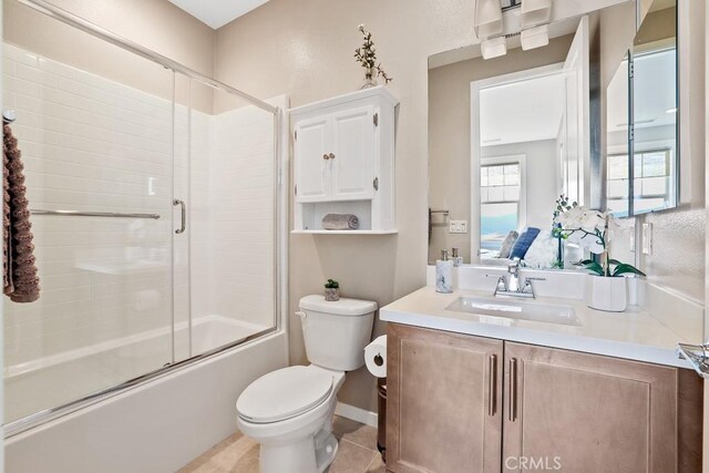7 Alienta Ln, Rancho Mission Viejo, CA 92694 - full bath featuring vanity, tile patterned flooring, combined bath / shower with glass door, and toilet