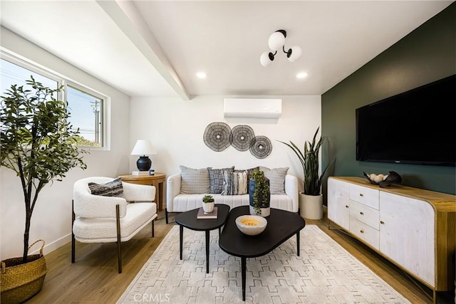 living room featuring wood finished floors, a wall mounted air conditioner, baseboards, and recessed lighting