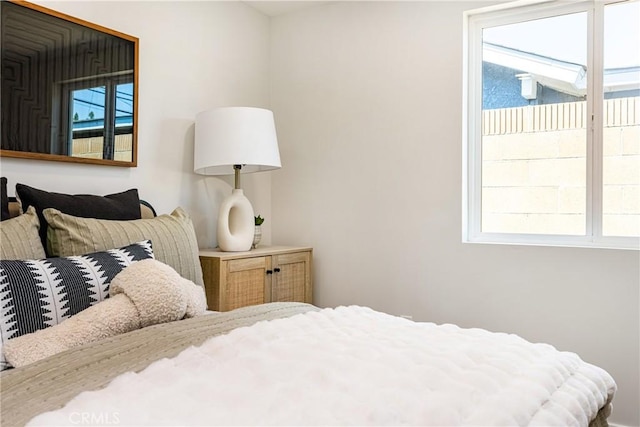 bedroom featuring multiple windows