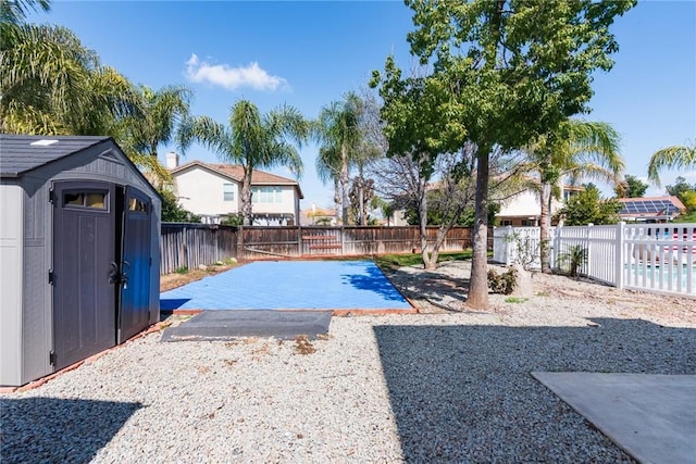 32460 Perigord Rd, Winchester, CA 92596 - view of swimming pool with a patio, a fenced backyard, and a shed