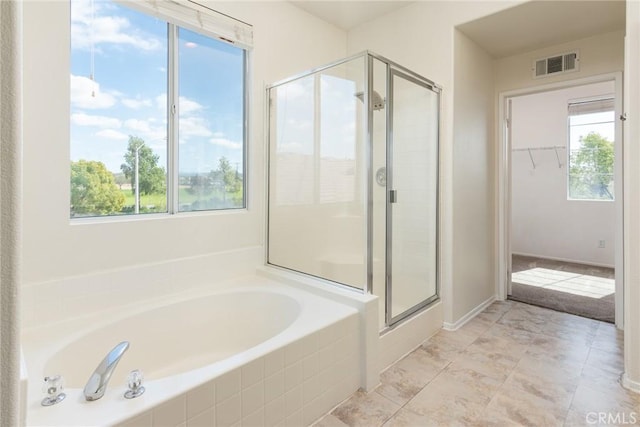 32460 Perigord Rd, Winchester, CA 92596 - full bath featuring a bath, a stall shower, healthy amount of natural light, and a walk in closet