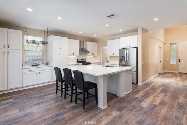 32460 Perigord Rd, Winchester, CA 92596 - kitchen with stainless steel refrigerator with ice dispenser, range with gas cooktop, white cabinetry, and recessed lighting