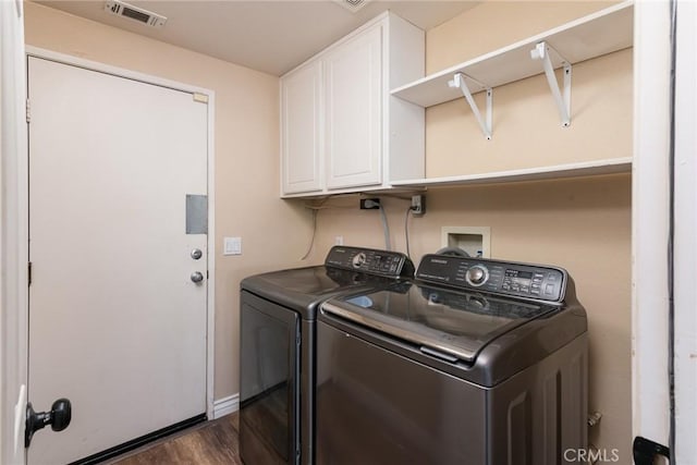 32460 Perigord Rd, Winchester, CA 92596 - washroom with cabinet space, washer and dryer, and dark wood-type flooring