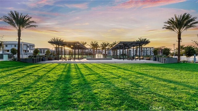 1884 S Union St Unit 43, Anaheim, CA 92805 - yard at dusk featuring a pergola