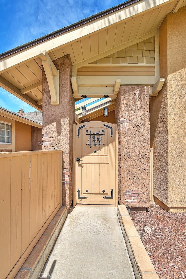 view of exterior entry featuring stucco siding