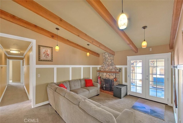 living area with french doors, carpet flooring, and lofted ceiling with beams