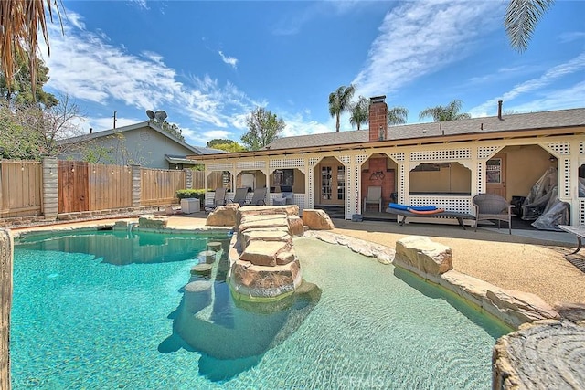view of pool with a patio, a fenced in pool, and fence