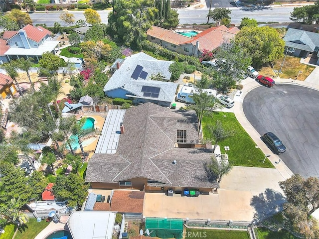 birds eye view of property with a residential view