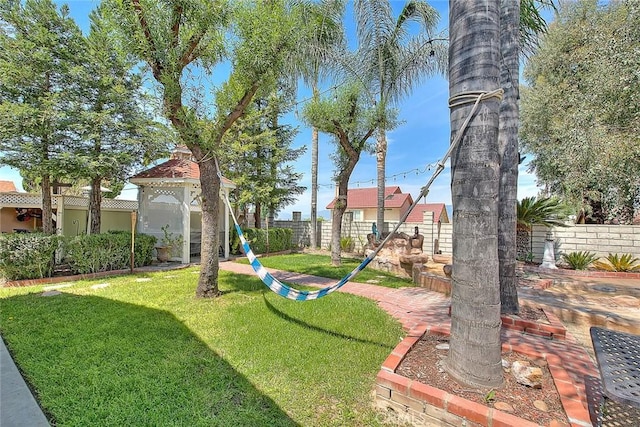view of yard with a fenced backyard