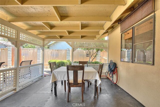 view of patio / terrace with outdoor dining area and fence
