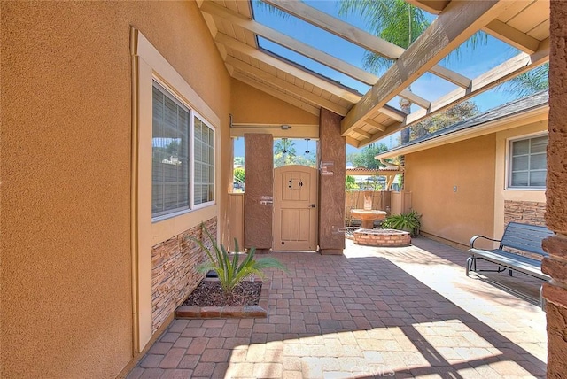view of patio / terrace featuring fence, a gate, and a pergola