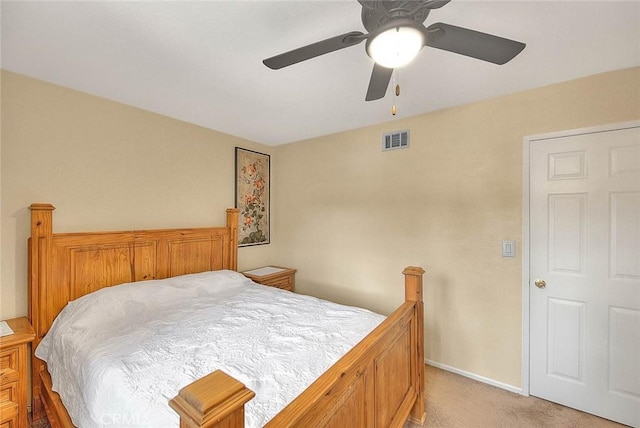 bedroom with light colored carpet, baseboards, a ceiling fan, and visible vents