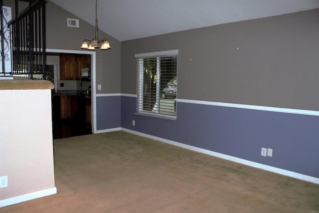 unfurnished dining area with an inviting chandelier, carpet floors, baseboards, visible vents, and high vaulted ceiling