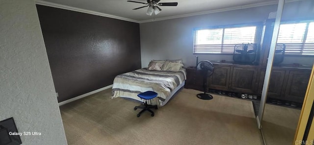 carpeted bedroom with a textured wall, ceiling fan, ornamental molding, and multiple windows