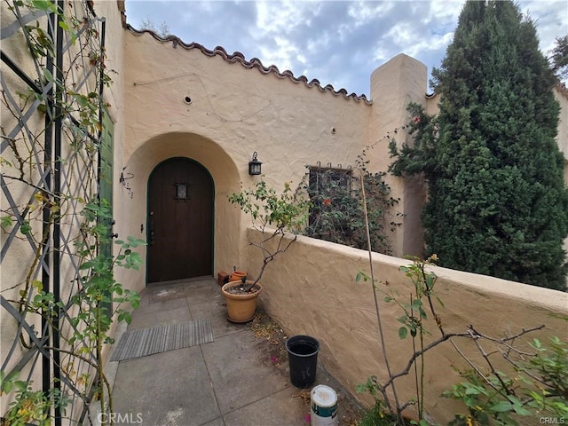 doorway to property with stucco siding