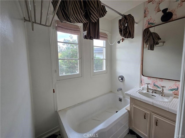 bathroom with a bath and vanity