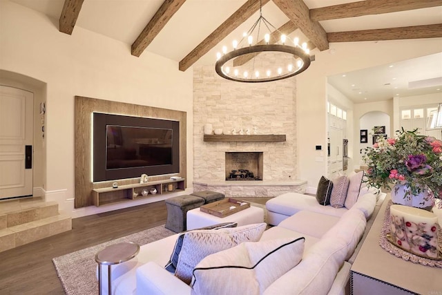 18320 Colina Fuerte, Rancho Santa Fe, CA 92067 - living area with a chandelier, wood finished floors, baseboards, and a stone fireplace