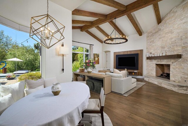 18320 Colina Fuerte, Rancho Santa Fe, CA 92067 - dining room with a chandelier, a fireplace, beamed ceiling, wood finished floors, and high vaulted ceiling