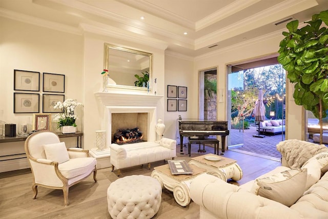 18320 Colina Fuerte, Rancho Santa Fe, CA 92067 - living area featuring wood finished floors, a raised ceiling, recessed lighting, a warm lit fireplace, and crown molding