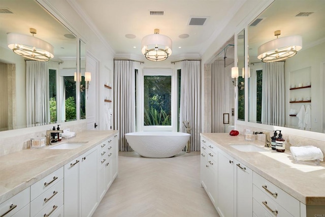 18320 Colina Fuerte, Rancho Santa Fe, CA 92067 - full bathroom featuring a chandelier, a soaking tub, two vanities, and crown molding