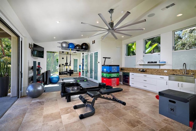 18320 Colina Fuerte, Rancho Santa Fe, CA 92067 - workout room with a sink, wine cooler, stone tile flooring, a ceiling fan, and plenty of natural light
