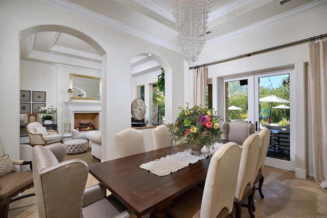 18320 Colina Fuerte, Rancho Santa Fe, CA 92067 - dining area with ornamental molding, a raised ceiling, healthy amount of natural light, and arched walkways
