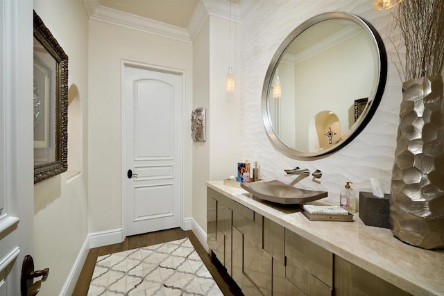 18320 Colina Fuerte, Rancho Santa Fe, CA 92067 - bathroom with ornamental molding, wood finished floors, baseboards, tasteful backsplash, and vanity