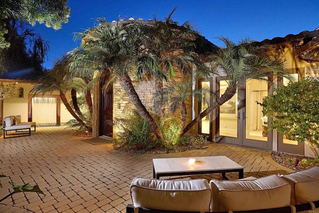 18320 Colina Fuerte, Rancho Santa Fe, CA 92067 - patio at night with french doors and outdoor lounge area