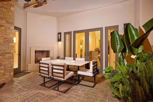 18320 Colina Fuerte, Rancho Santa Fe, CA 92067 - view of patio / terrace featuring outdoor dining space and a fireplace with raised hearth