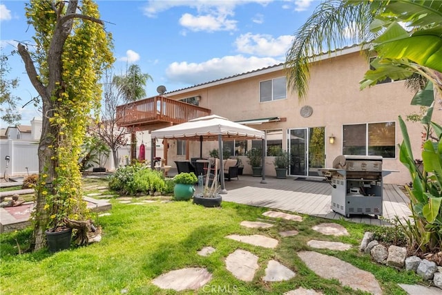 13126 Glandt Ct, Corona, CA 92883 - rear view of property with a yard, a deck, stucco siding, and fence